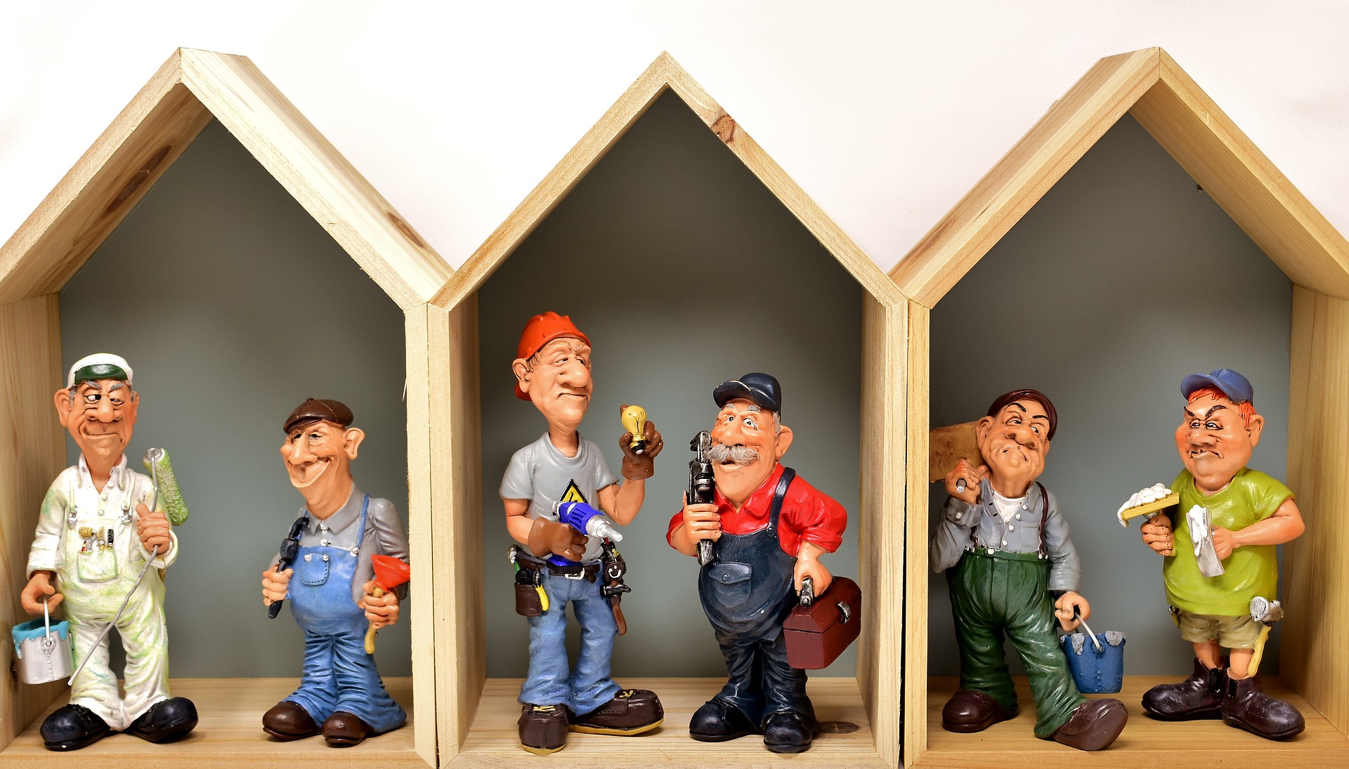 These cartoon figurines represent individuals who might use an electric stacker truck.